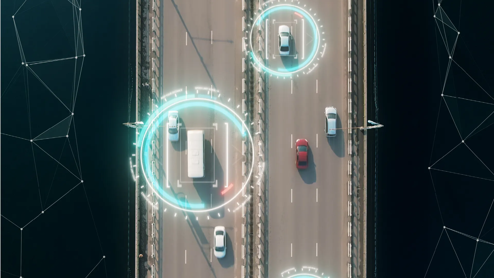 multiple cars driving on a bridge from a birds eye view